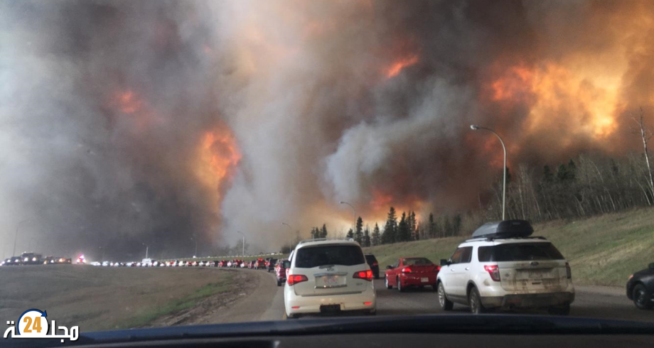 إجلاء مئات السكان من منازلهم في غرب كندا بسبب الحرائق وموجة الحر